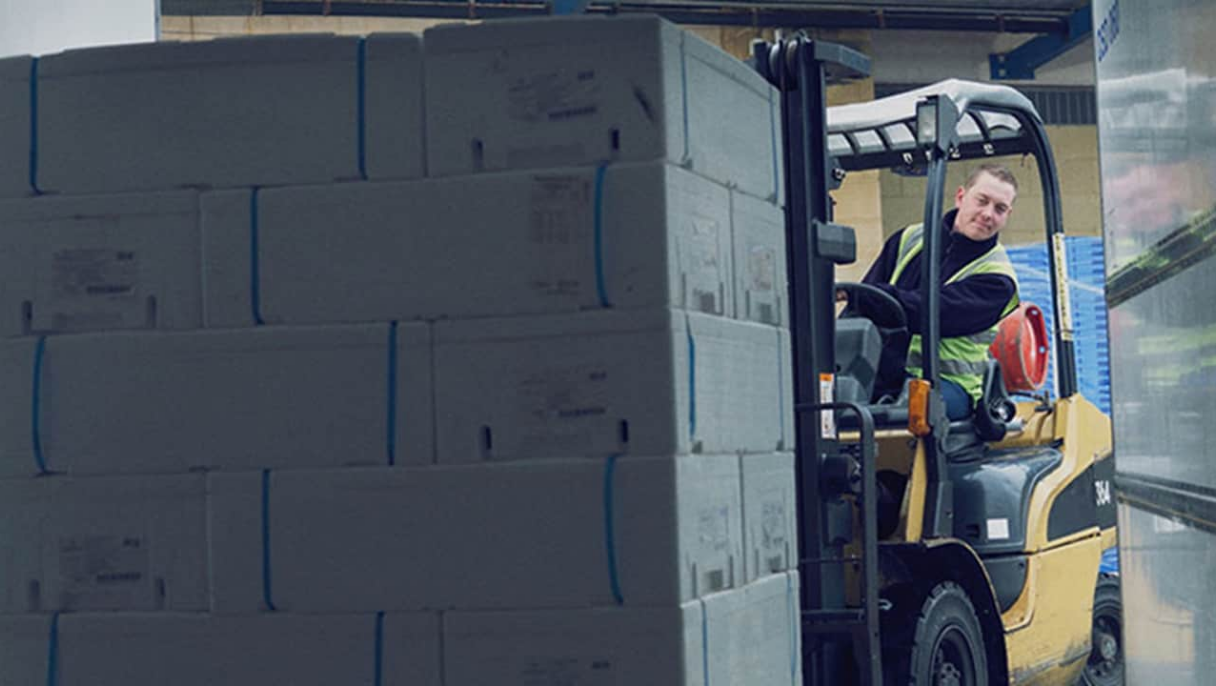 man driving fork lift